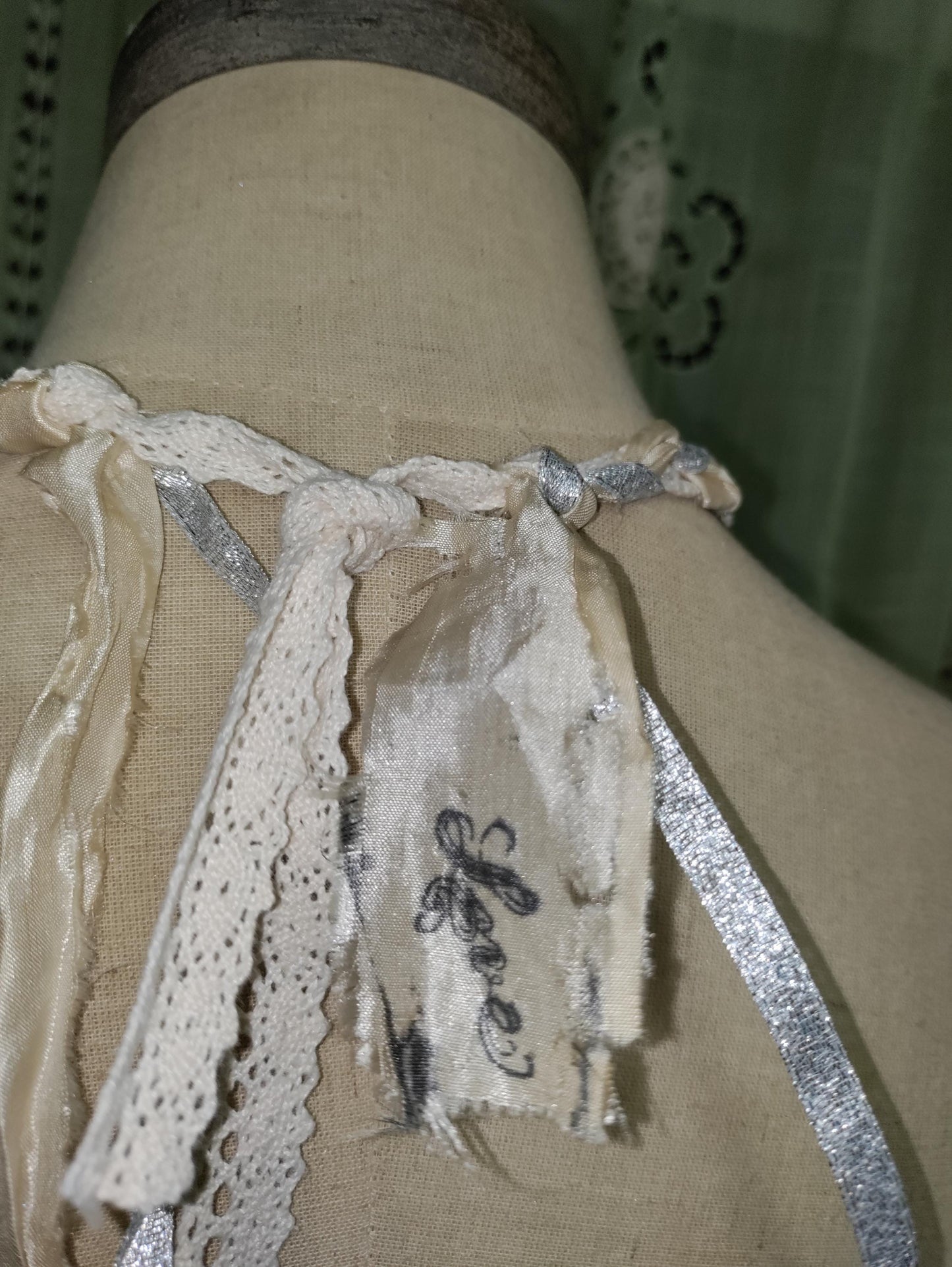 Frozen Charlotte's Wings. Up to Heaven on ribbons of crochet, silk ivory and silver sparkling ribbons. Fidget with a piece of the past!