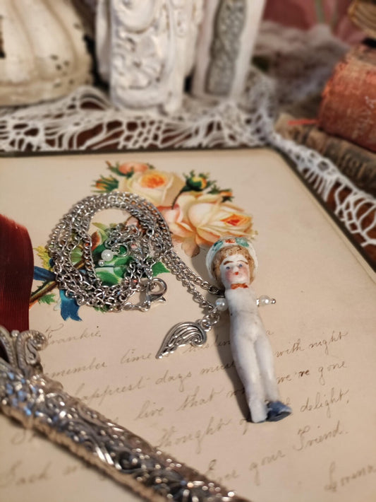 Soul of the Forgotten - Frozen Charlotte antique bisque penny doll necklace, front view