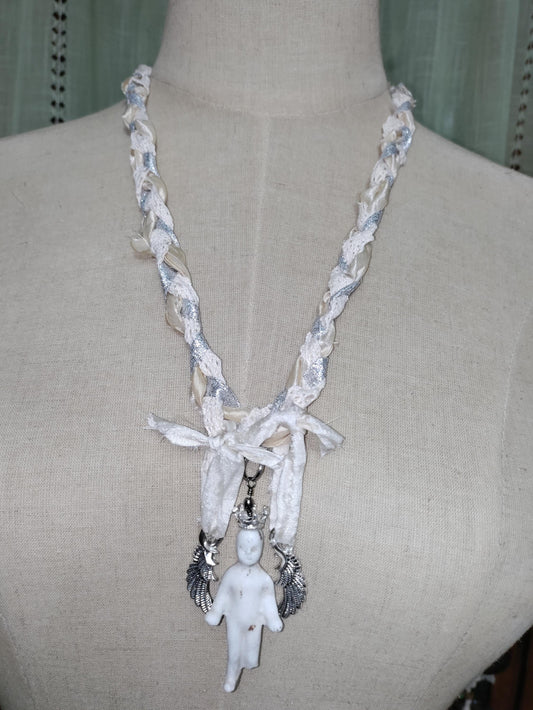 Frozen Charlotte's Wings. Up to Heaven on ribbons of crochet, silk ivory and silver sparkling ribbons. Fidget with a piece of the past!