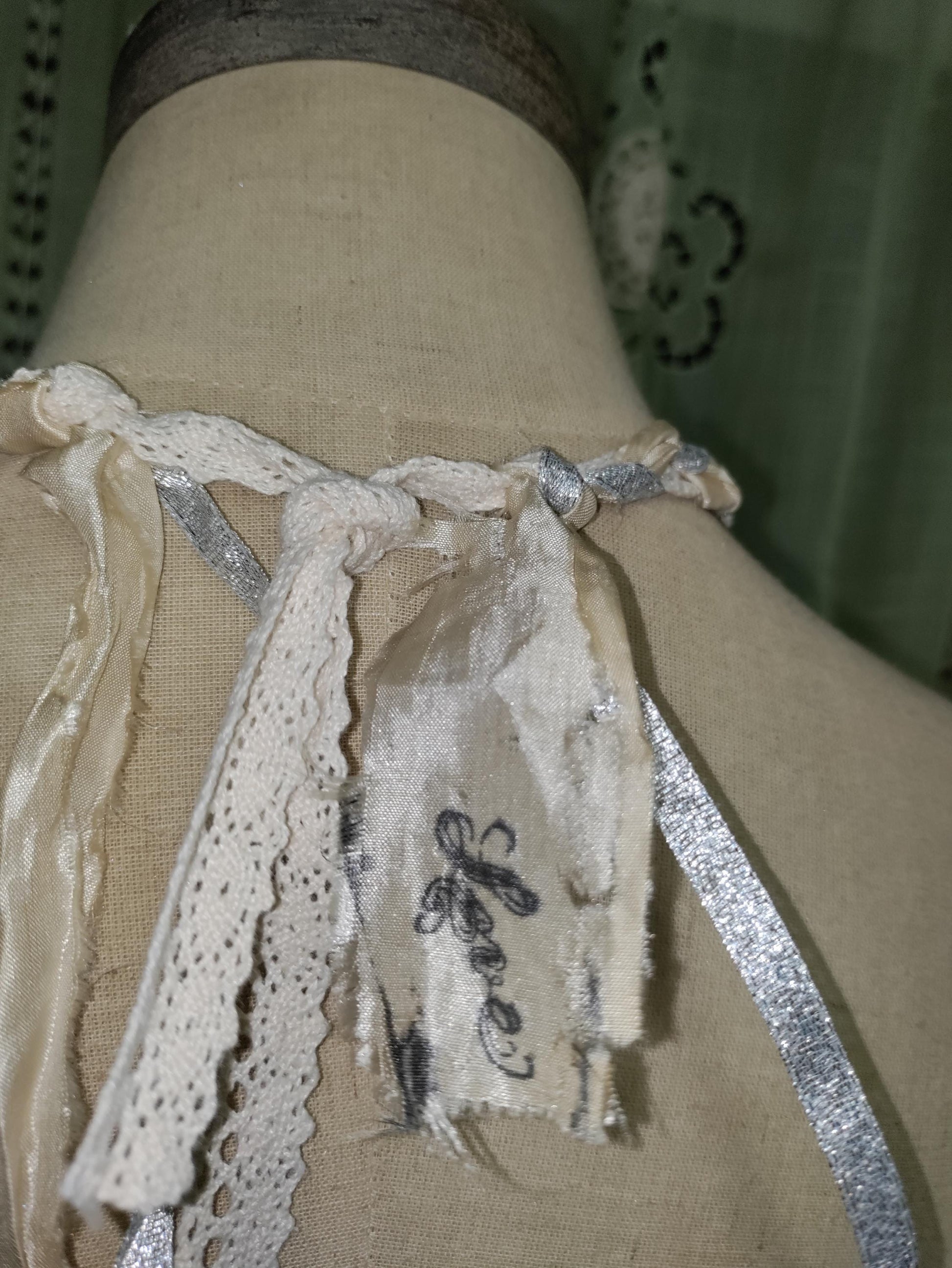 Frozen Charlotte's Wings. Up to Heaven on ribbons of crochet, silk ivory and silver sparkling ribbons. Fidget with a piece of the past!