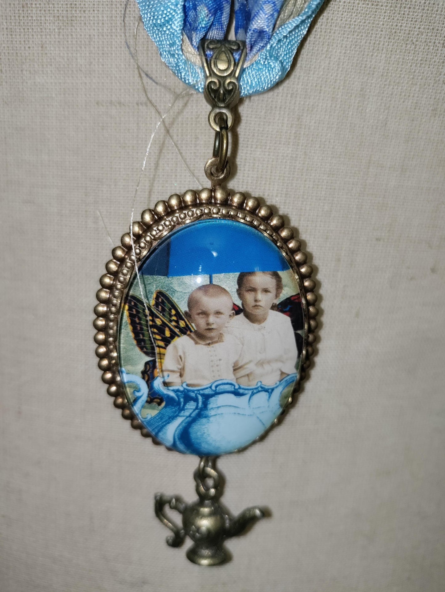 Tea Time with Fairies. Vintage photo pendant with butterfly wings.