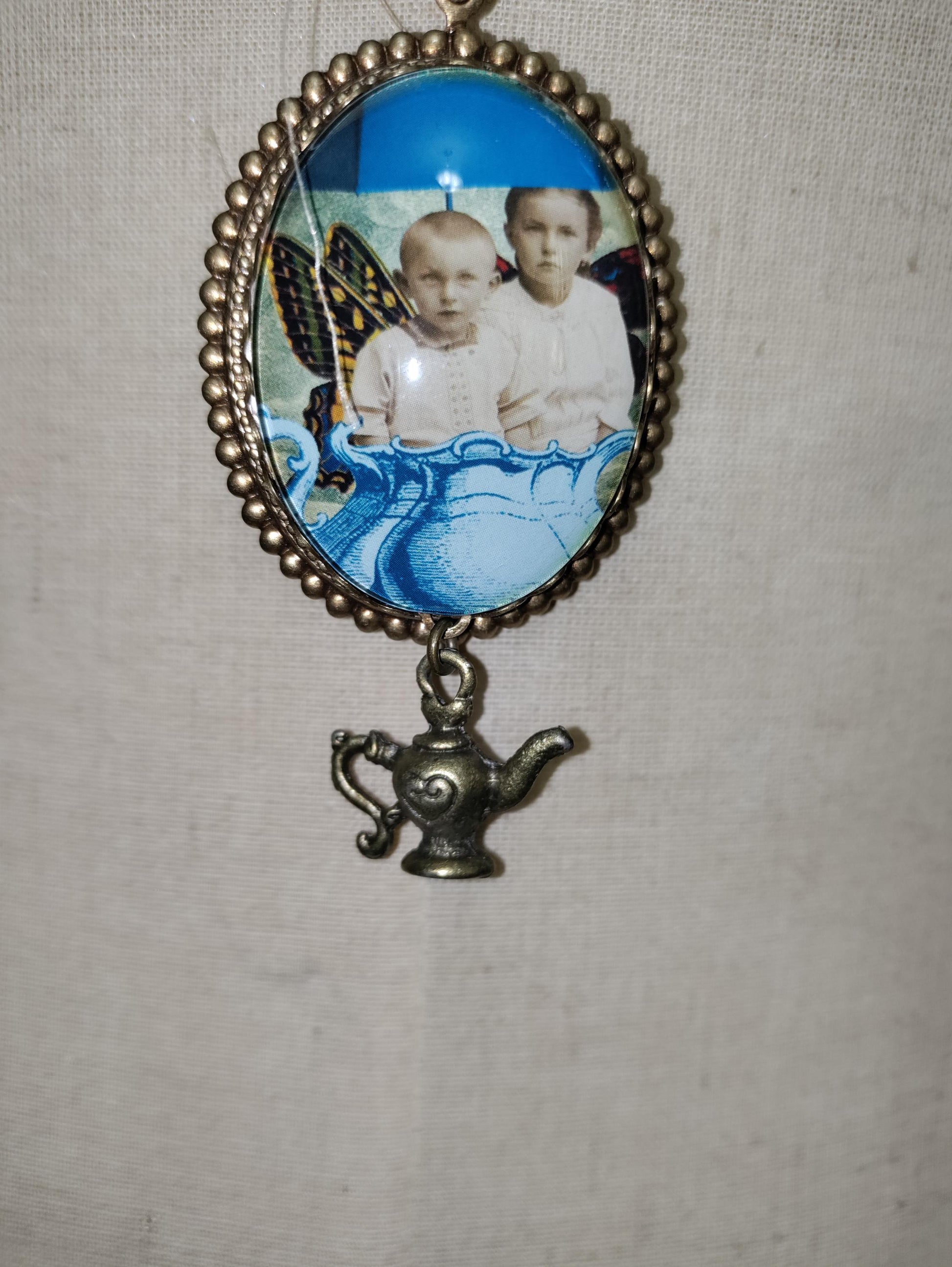 Tea Time with Fairies. Vintage photo pendant with butterfly wings.