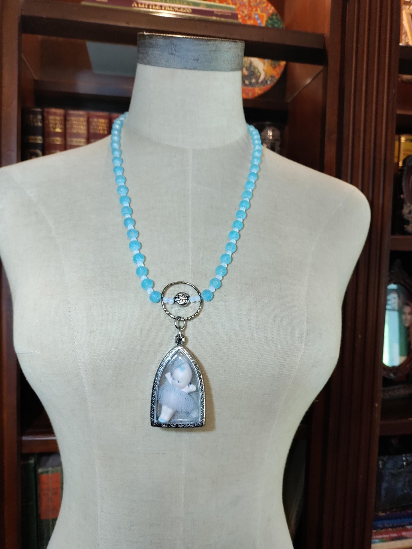 Tiny Dancer Kaptured Kewpie Doll: Frosted Blue Glass Beads. White Opalescent Beads.