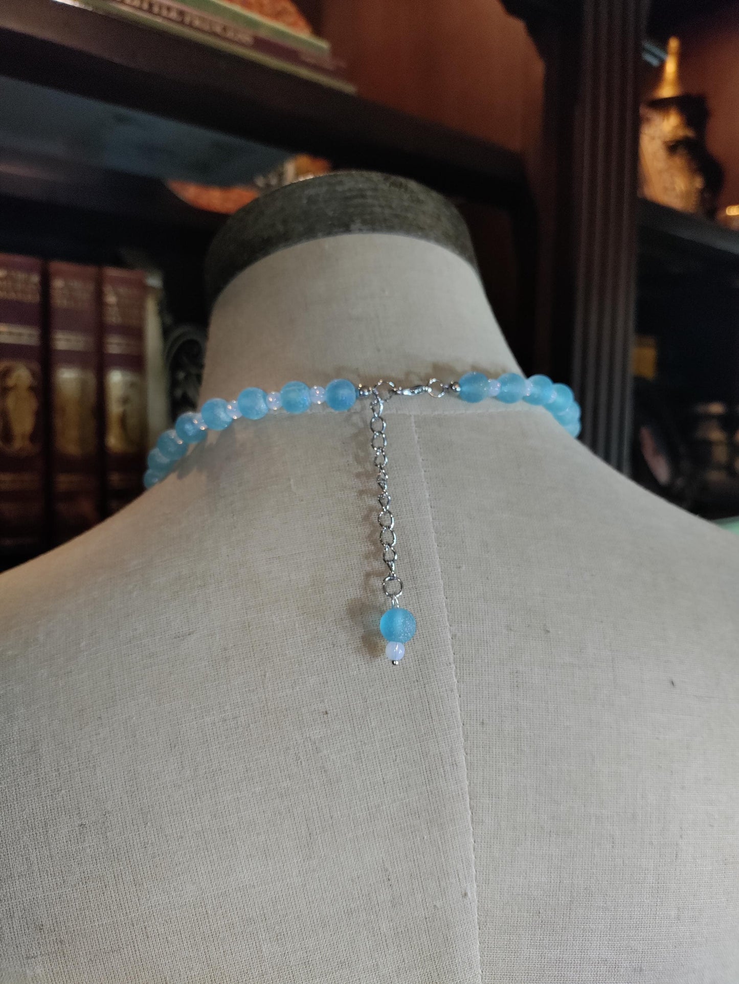 Tiny Dancer Kaptured Kewpie Doll: Frosted Blue Glass Beads. White Opalescent Beads.