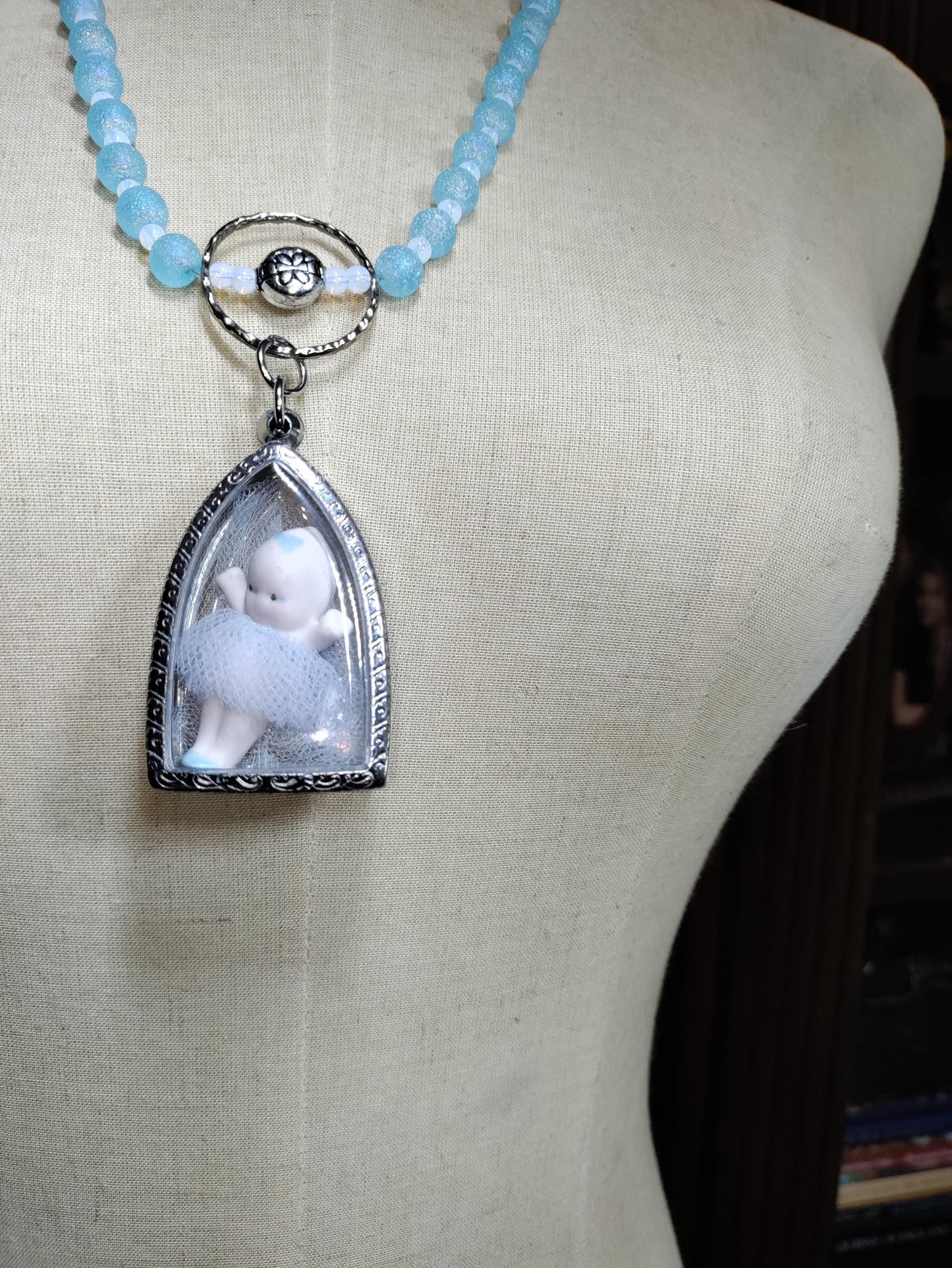 Tiny Dancer Kaptured Kewpie Doll: Frosted Blue Glass Beads. White Opalescent Beads.